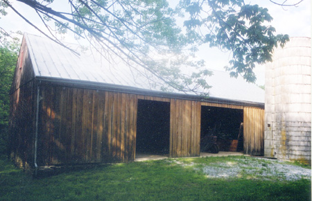 Dahlgren Street barn restoration project, finished view of exterior siding and new sheet metal roof.
