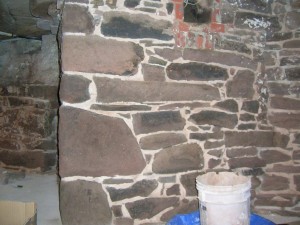 Areas of the building's blue stone foundation (both interior and exterior) were re-pointed using a raked joint.