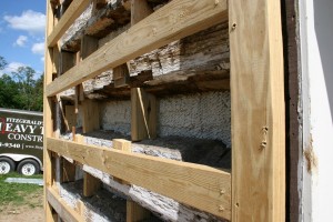Where the gaps between the logs were originally filled with rubble, bits of wood, and mortar, we'll fill those spaces with insulating foam.