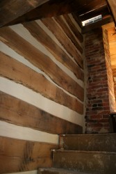 The interior of all walls are chinked with new historically sensitive mortar.  This is the fire-damaged area, good as new!