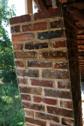 Now is the time to reconstruct the chimneys.  Notice the string-lines used to ensure we follow the same slant as the original chimney.