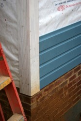 The trim and siding are clear yellow pine for durability.  The siding is custom-milled "dutch lap" pattern to match the original.  All wood is treated with linseed oil and painted with a traditional lindseed oil paint.