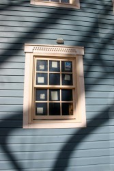 We replicated the existing dentil-style window head trim at the heads of our modern, energy efficient windows.