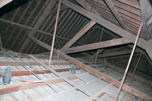 The large main trusses hold up the slate roof and the decorative vaulted plaster ceiling.  The large (8"x12") oak timbers are still doing a great job after 150 years of service, but need a little maintenance to ensure they keep up the good work for another century and a half.