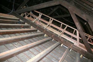 The original ceiling rafters were surprisingly poorly assembled, with odd splices left carrying too much weight without proper support.  Modern lumber "sisters" help stabilize things and also carry our new walks.