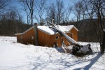 FHTC Safely Removed a Large Fallen Tree From This Log Cabin